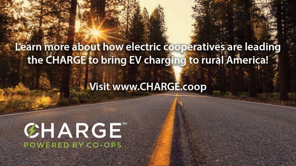 CHARGE ad that shows a photo of a paved road with the text that reads: "Learn more about how electric cooperatives are leading the CHARGE to bring EV charging to rural America! Visit www.CHARGE.coop