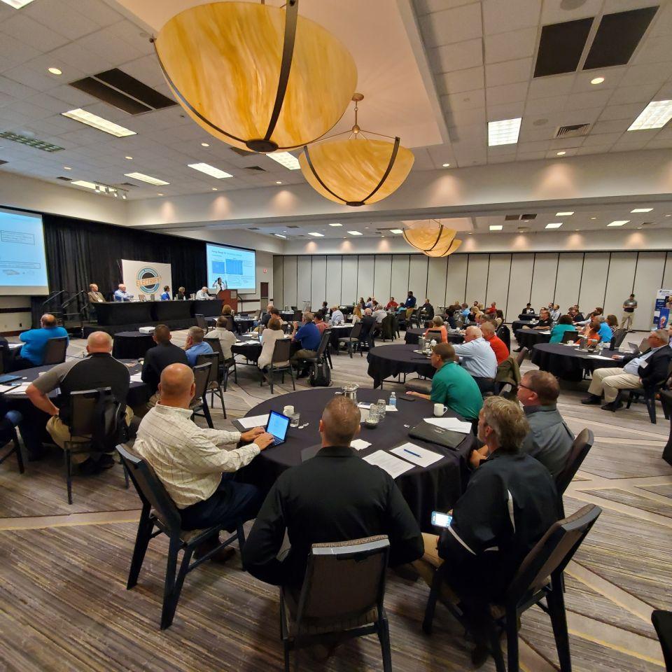 long shot of participants of the Electrify Iowa! summit as they listen to a presenter