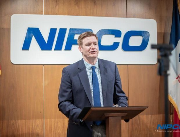 NIPCO's General Manager Matt Washburn presents from a podium at the NIPCO annual meeting
