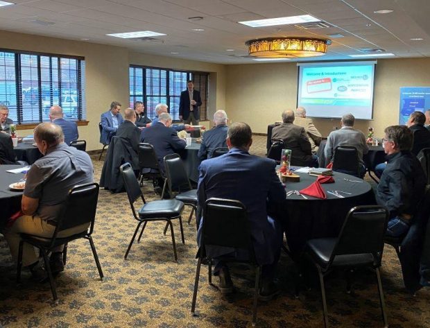 Photo of legislative meeting with several participants watching the presenter