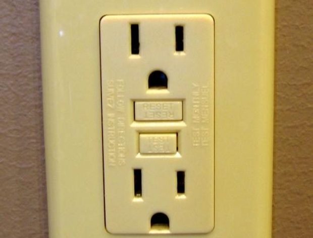 Image of GFCI outlet plug installed on a wall