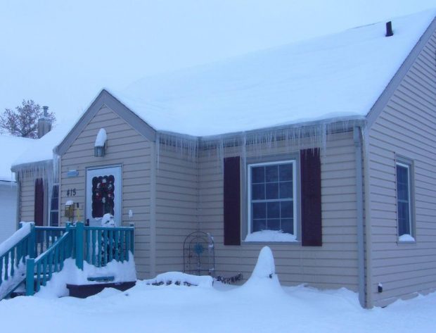 image of a house with icicles hanging from the roof