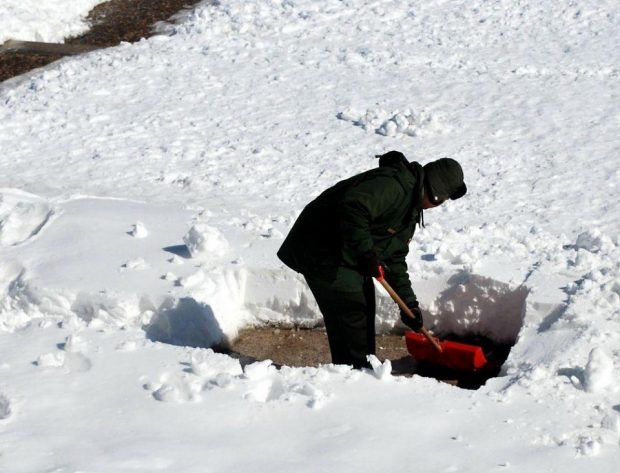 man shoveling snow