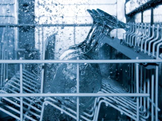 Photo image of glasses in a dishwasher rack.