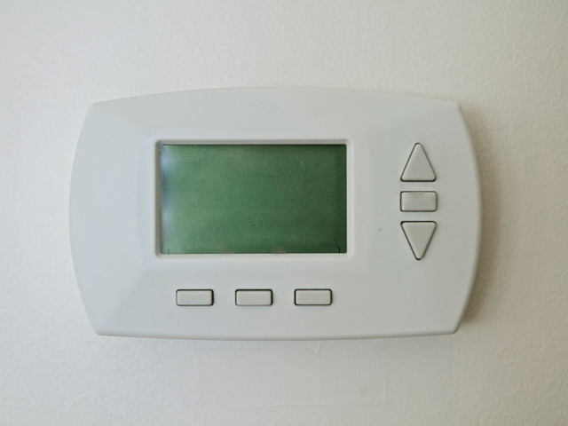Photo image of a programmable thermostat.