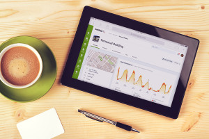 Tablet Computer With Blank White Screen as Copy Space on Office Table.
