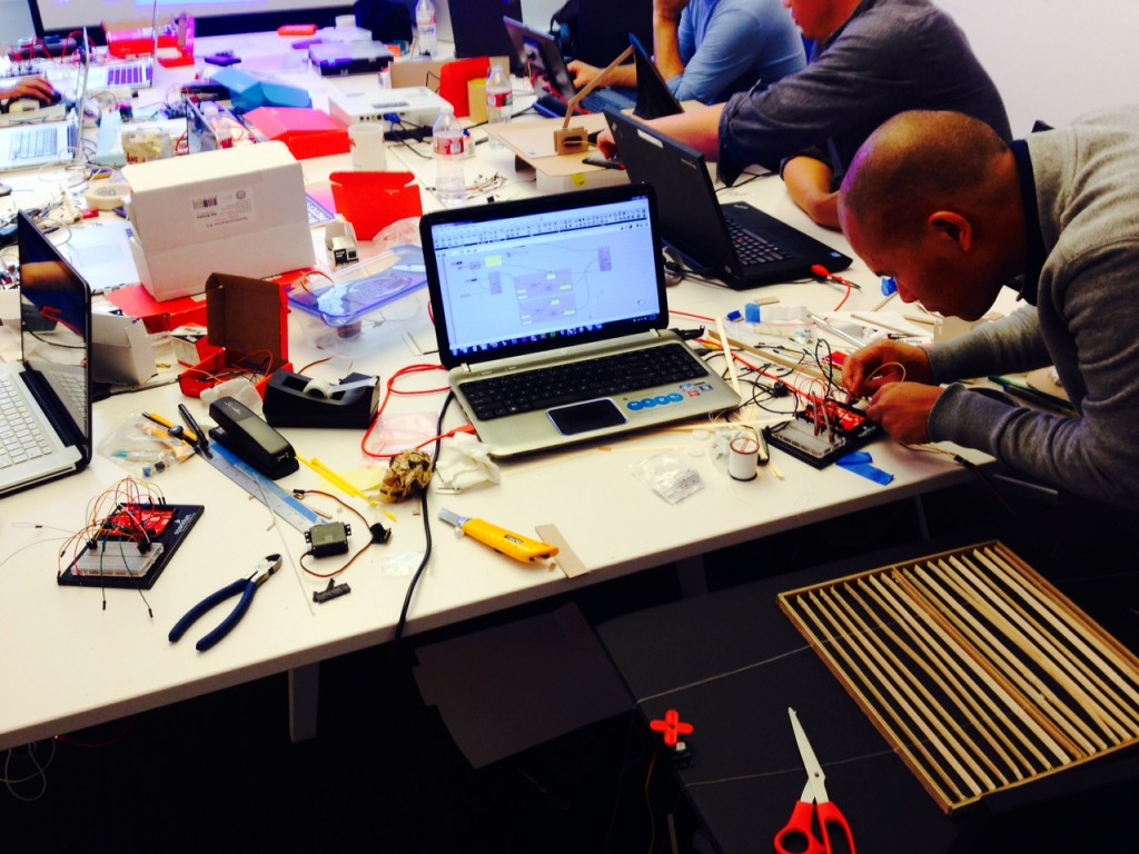 A responsive facade prototype is being laced up and programmed.