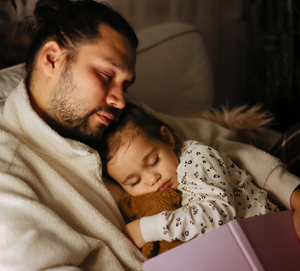 Father holding small daughter