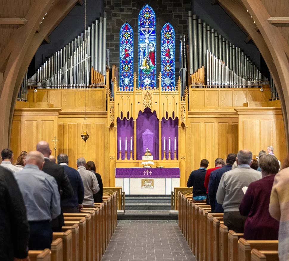 Church sanctuary with worshipers 