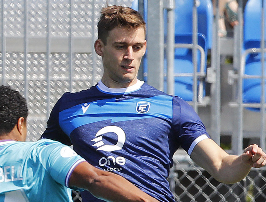 May 12, 2019; Edmonton, Alberta, CAN; Pacific FC midfielder Terran Campbell (14) defends a pass by FC Edmonton defender Amer Didic (55) during a Canadian Premier League soccer match at Clarke Stadium. Mandatory Credit: Perry Nelson-USA TODAY Sports for CPL