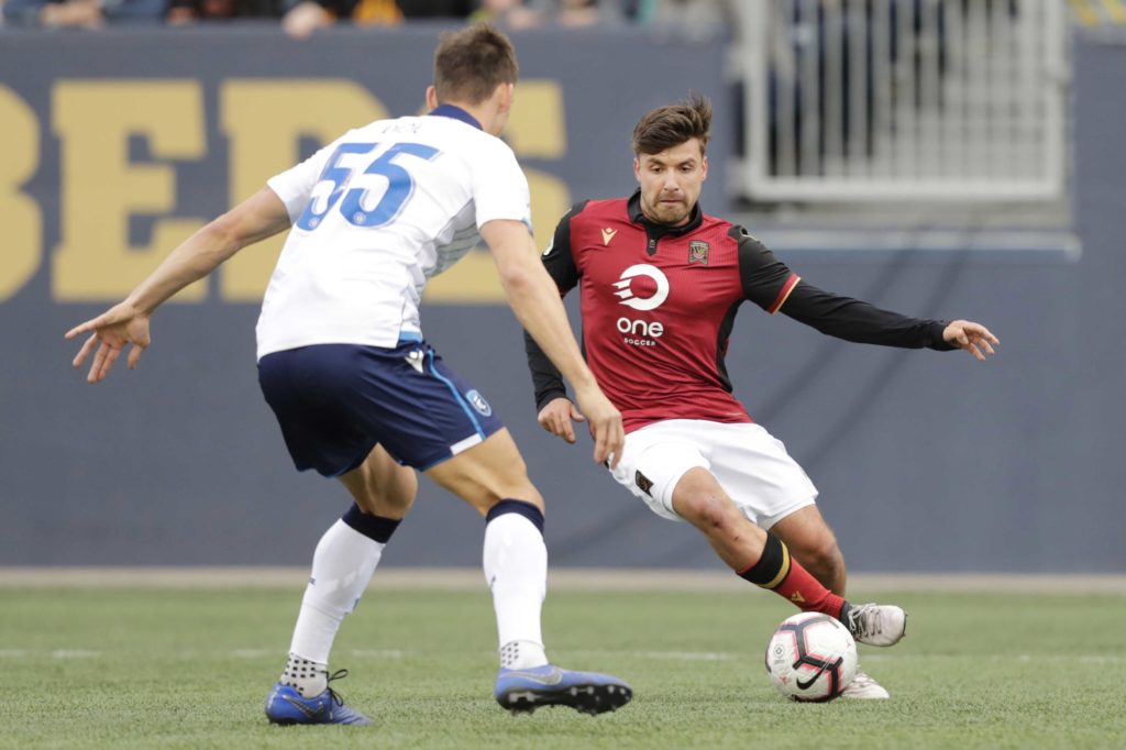 May 4, 2019; Winnipeg, Manitoba, CAN; FC Edmonton defender Amer Didic (55) blocks a kick by Valour FC midfielder Michael Petrasso (9) in the second half during a Canadian Premier League soccer match at Investors Group Field. Mandatory Credit: James Carey Lauder-USA TODAY Sports for CPL