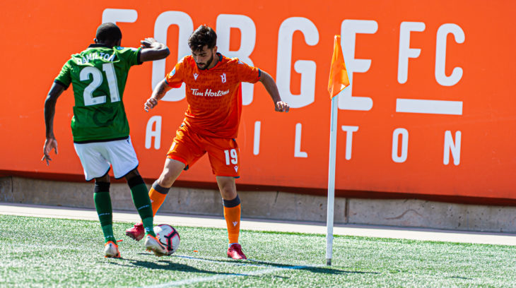 Forge FC's Tristan Borges stands down Cavalry defender Malyk Hamilton. (Ryan McCullough/CPL).
