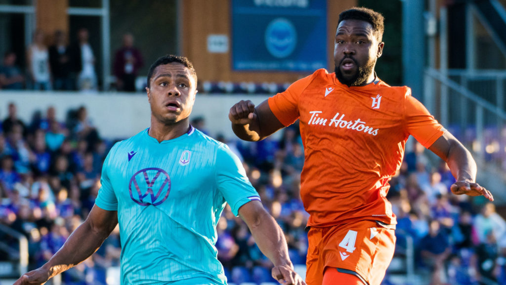 Pacific FC's Terran Campbell and Forge FC's Dominic Samuel battle for the ball. (Photo: Pacific FC)