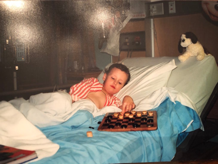 A young Dylon Powley playing checkers while at the Stollery Hospital.
