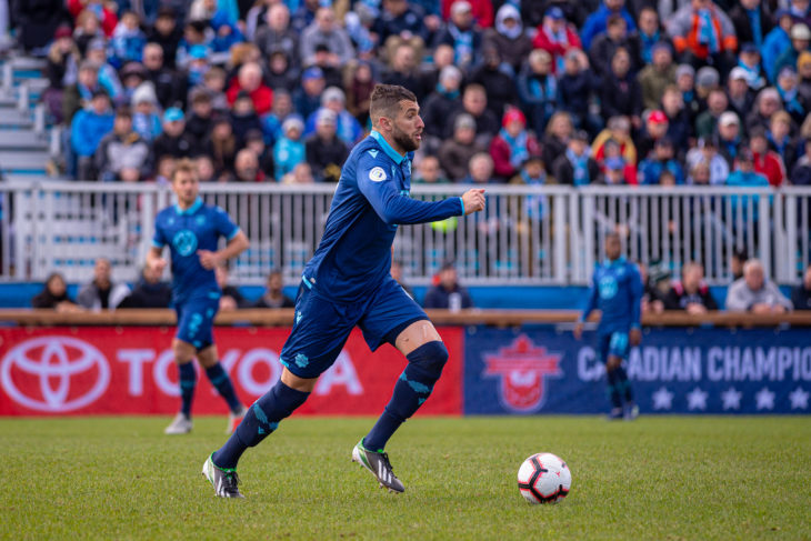 Chakib Hocine bringing the ball out of defence against Vaughan in the Canadian Championship first round. Photo: Trevor MacMillan.