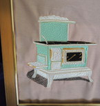 framed embroidered art, antique stove