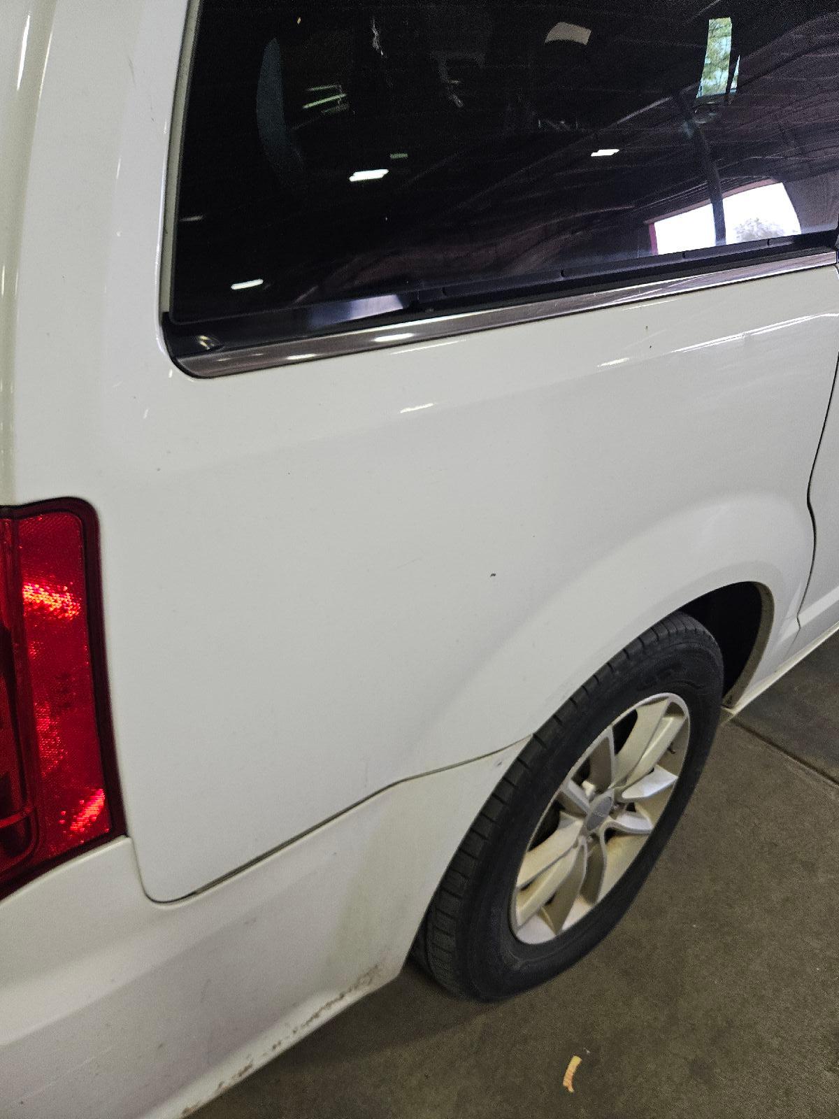 Dented Gradung Bucket Rear Bumper Cover (Light Mult Scratches)