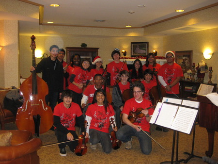 Group Pose After Performance At Memory Care Home T-Shirt Photo