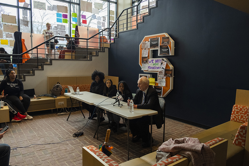Students sitting inside crouse-hinds for negotiations