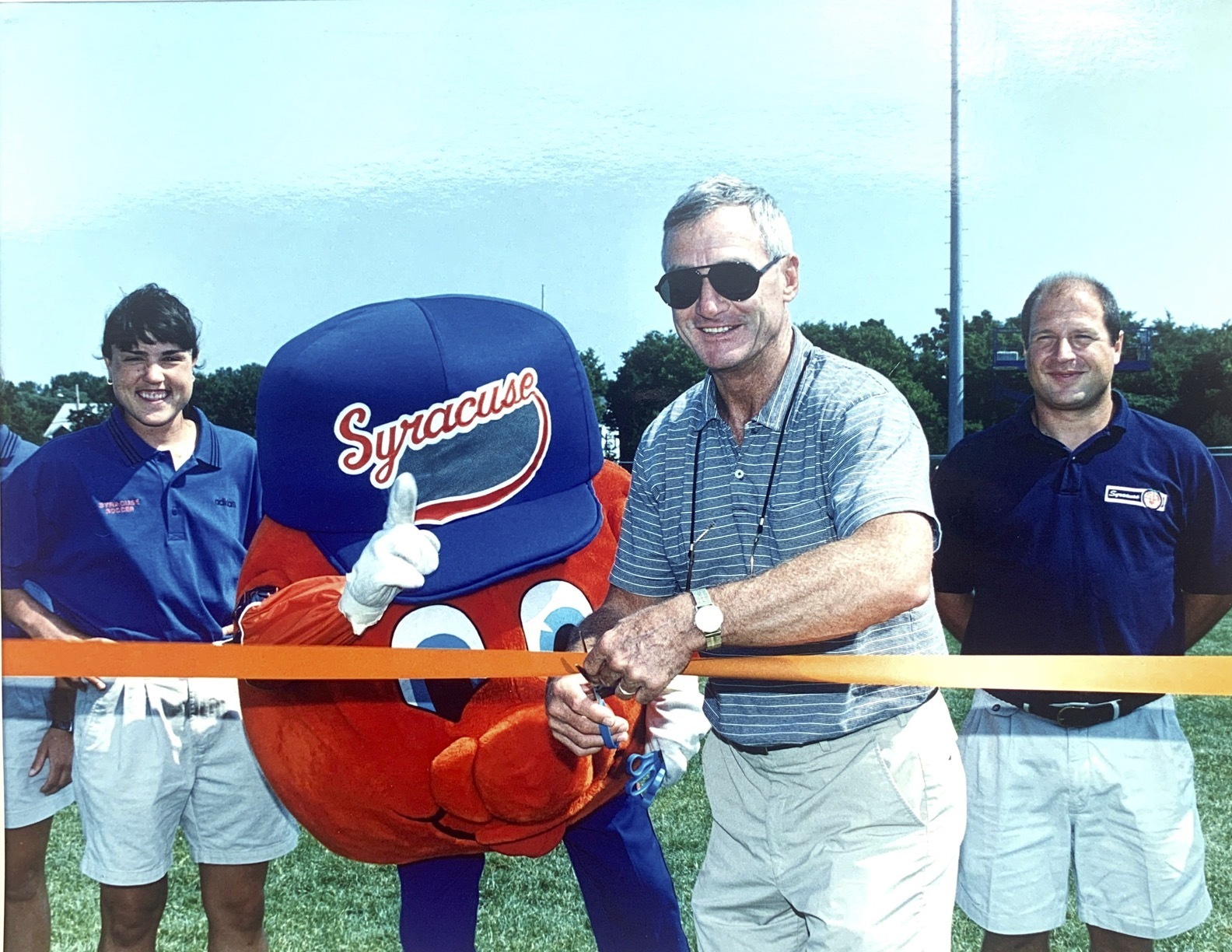 Jake Crouthamel cuts the ribbon at women's soccer opening