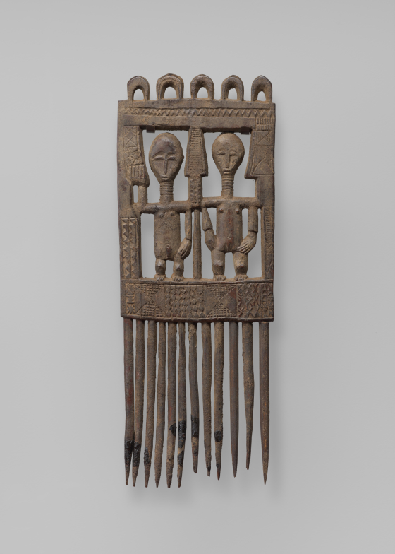 Comb with Two Standing Figures