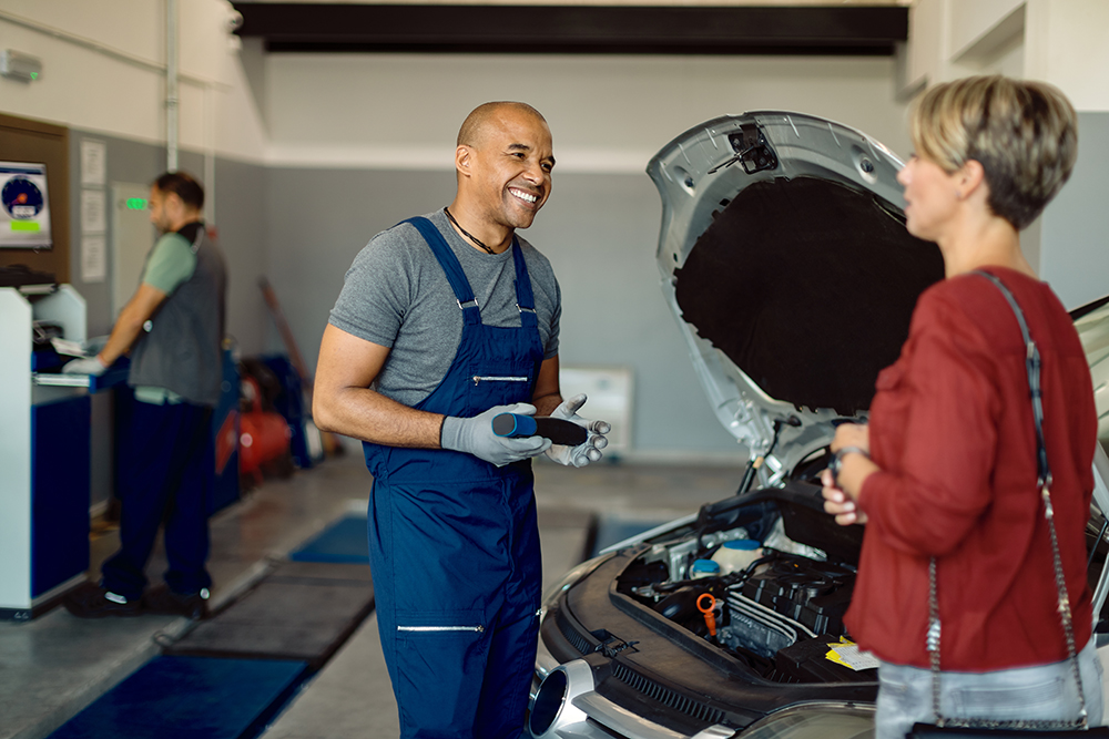 CarVision service technician performing an oil change