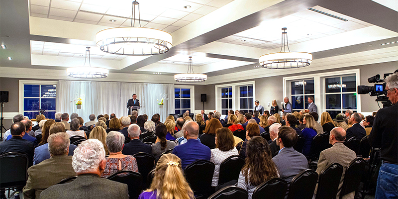 special event being hosted at the 2nd floor gallery with hosts on stage with guests