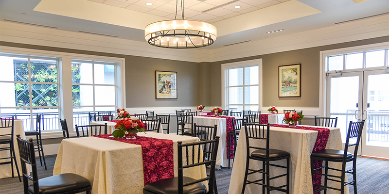 2nd floor gallery red and white table seatings near windows