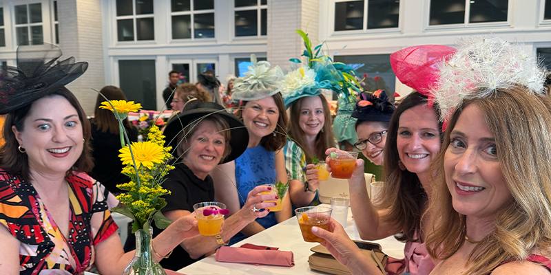 ladies drinking at a table in the oaks terrace room