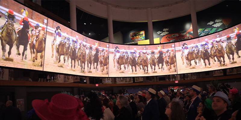 guests watching the greatest race on the great hall 360 screen