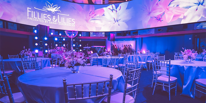 fillies and lilies event in the great hall with purple lighting