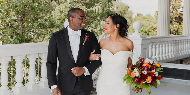 couple smiling on the 2nd floor gallery balcony