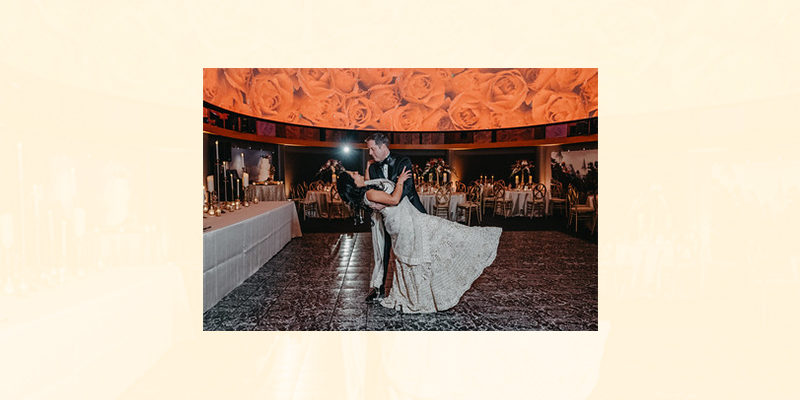 couple in the great hall dancing in the center of the room
