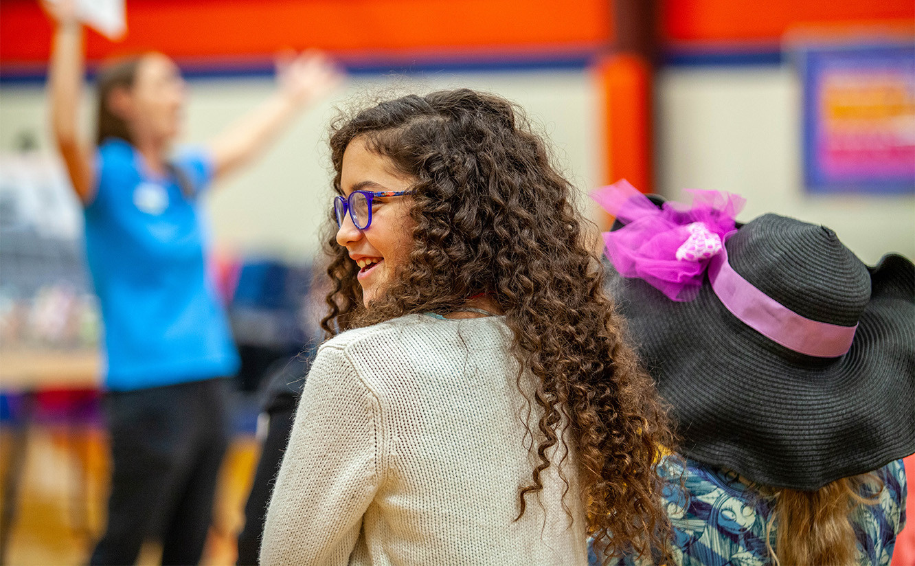 Girl smiling during KDM educational lesson
