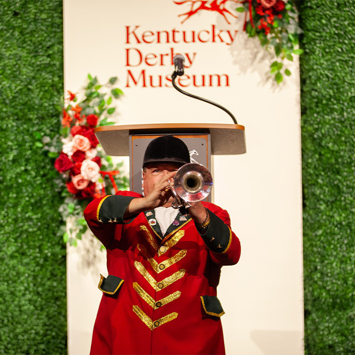 Steve Buttleman, bugler, playing "Call to Post" on stage
