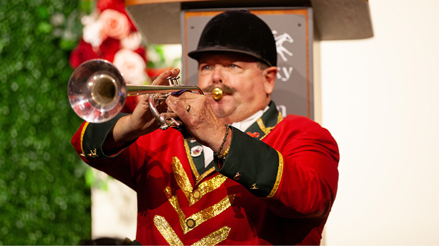 Steve Buttleman, bugler, playing "Call to Post" on stage