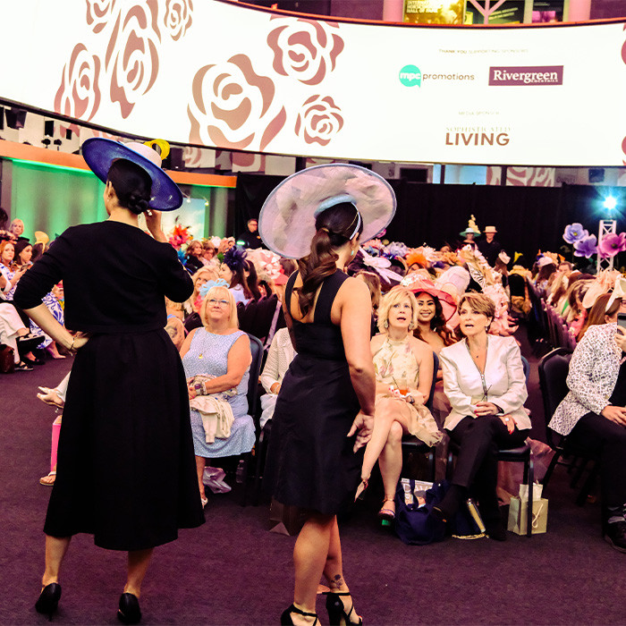 Audience at the Hat Show lookin at models