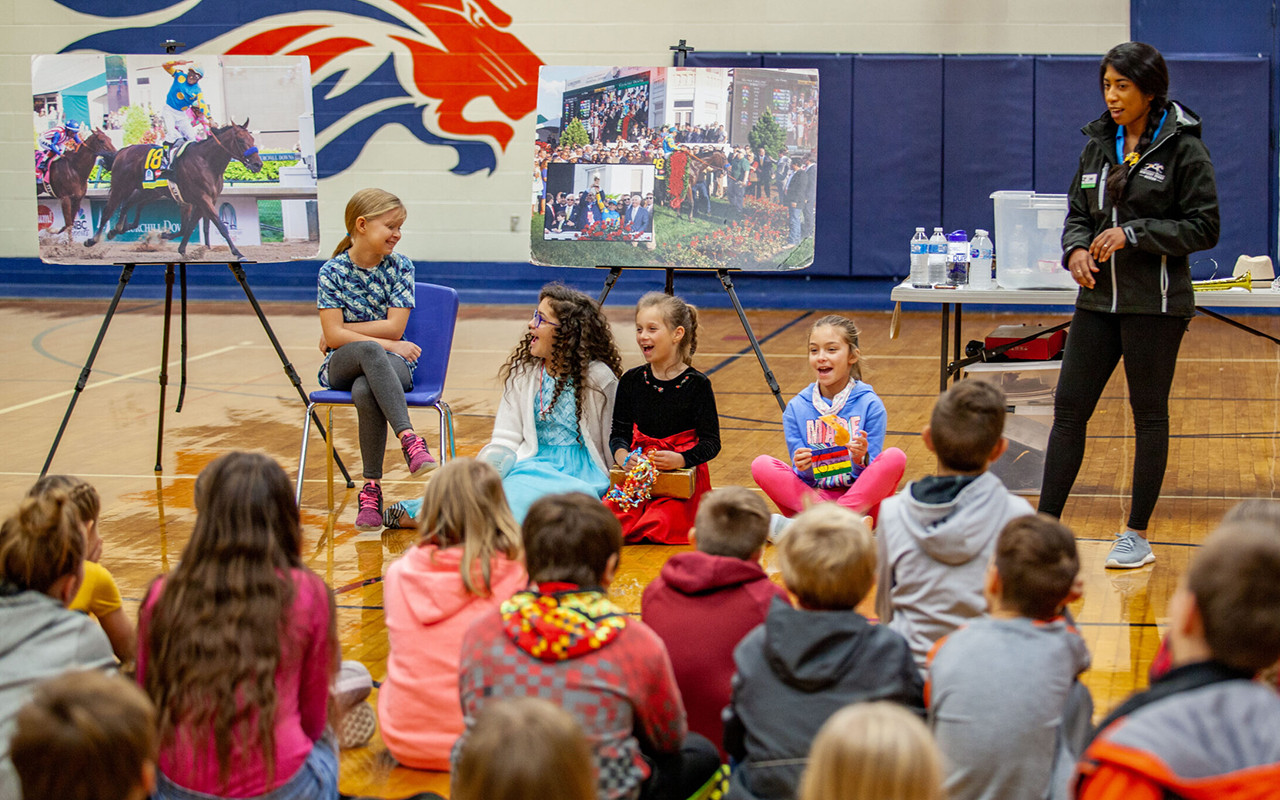kdm educator teaching students in gym