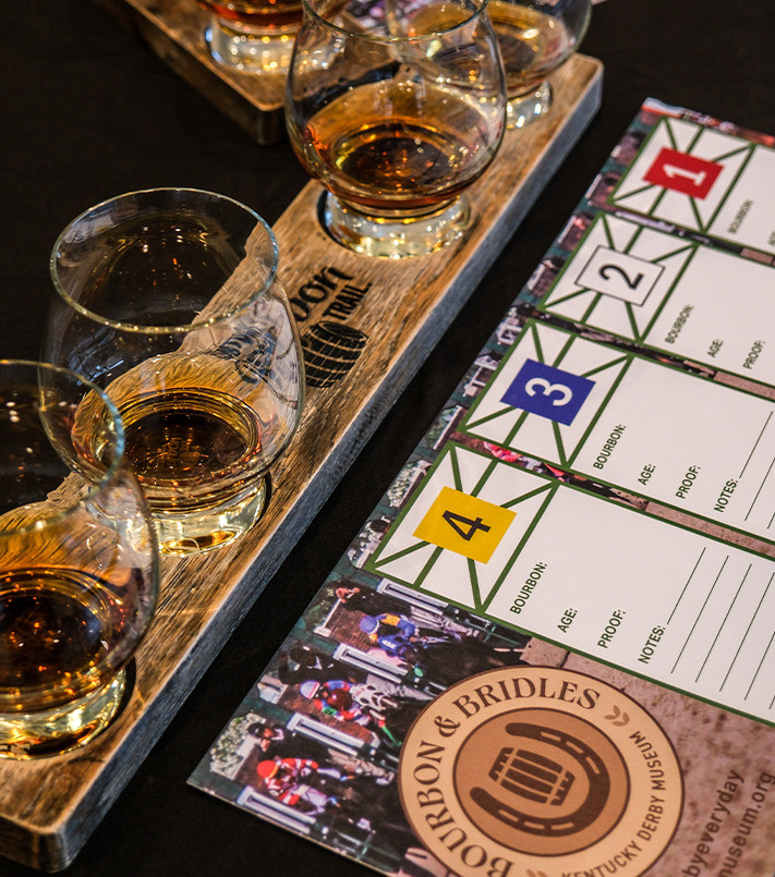 Bourbon poured in tasting glasses with tasting notes