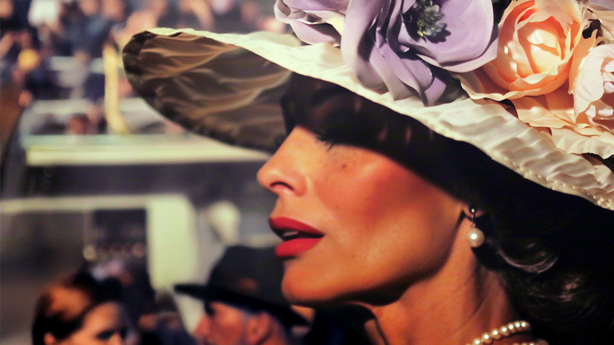 woman wearing a derby hat with flowers