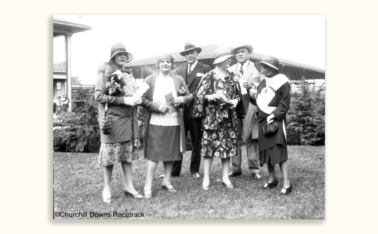 black and white picture of men and women in jazz age attire at the Derby