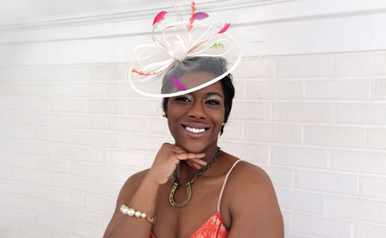 woman wearing a white derby hat with color accents