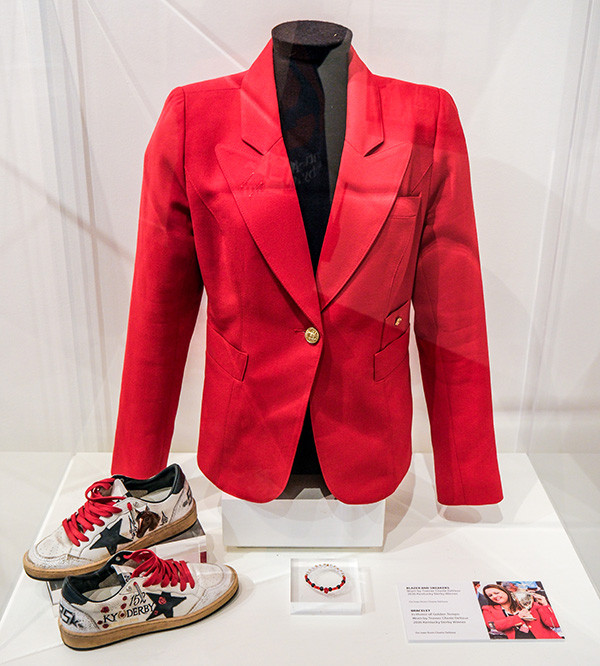 CCustom shoes, bracelet, and red blazer worn by trainer Cherie DeVaux