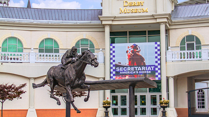 The front of the Kentucky Derby Museum and Barbaro Statue