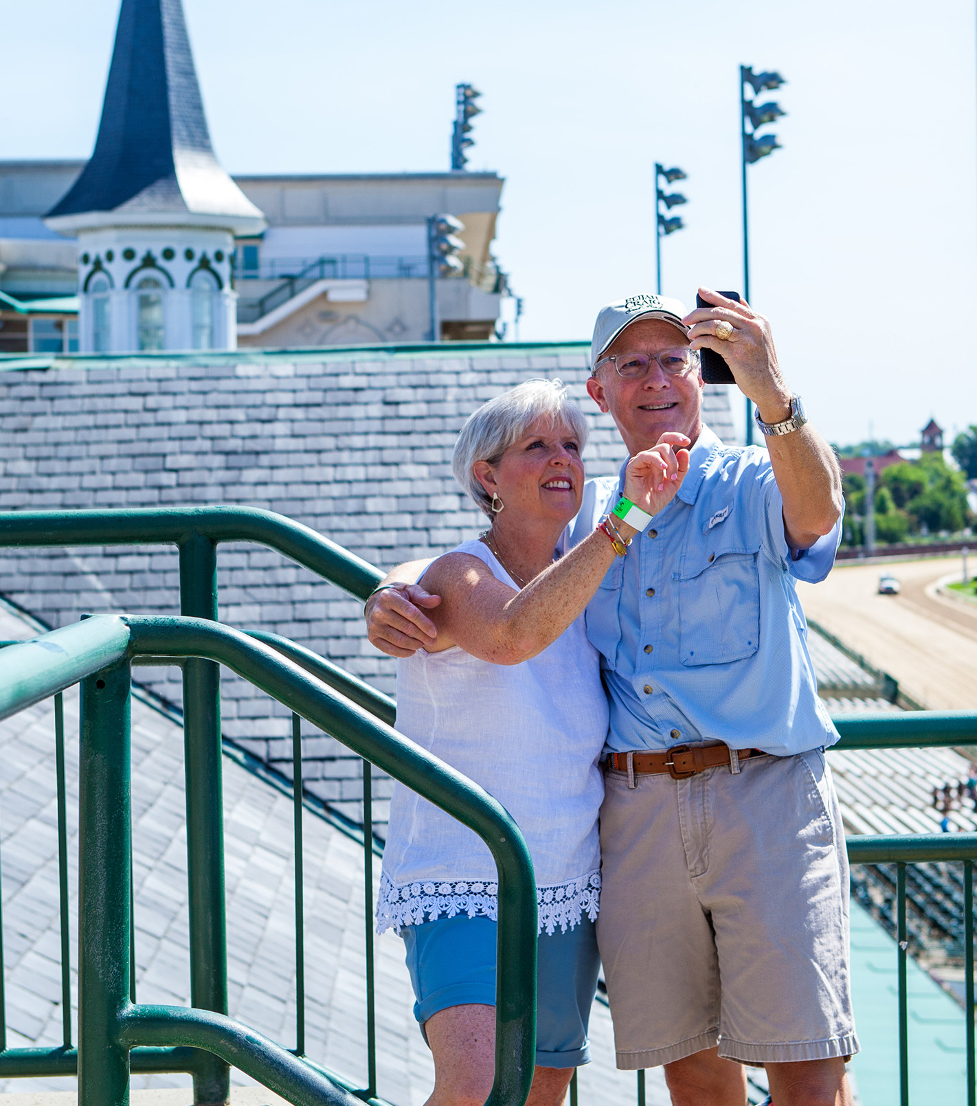 couple taking a picture in front of the Twin Spires