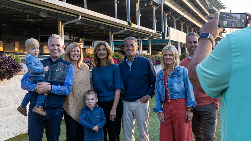 family getting their picture taken at the track