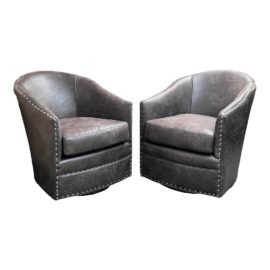 Arhaus Giles Swivel Leather Chairs, a Pair. Original Price: $5,000