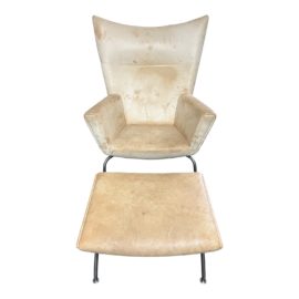 Hans J. Wegner Ch445 Wing Chair + Ottoman. Original Price: $10,000