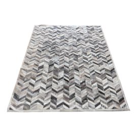 Naturally Distressed Chevron Cowhide Area Rug - 9′ × 10′11″. Original Price: $2,800