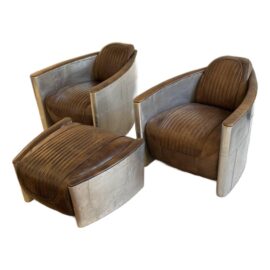 Aviator Chairs by Restoration Hardware + Ottoman, a Set of 3. Original Price: $8,000